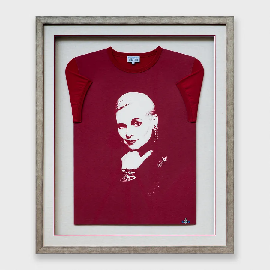 A red Vivienne Westwood T-shirt framed in a silver frame with a linen mount