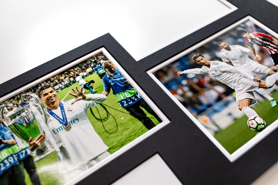 Signed match photos set into a black double mount