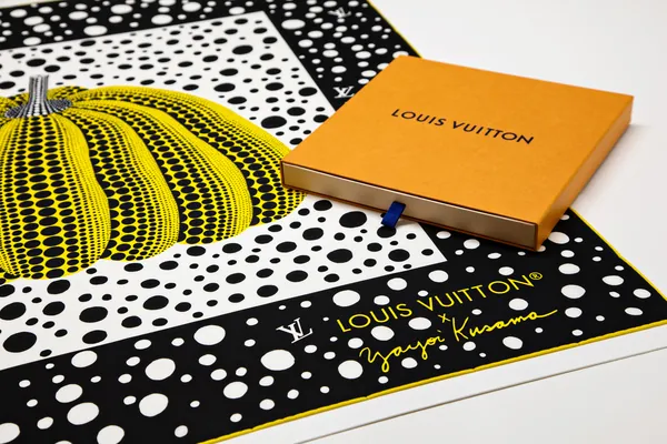 The scarf with its orange Louis Vuitton box