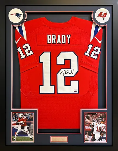 Framed signed Tom Brady shirt with Patriots and Buccaneers badges, match images and engraved plaque