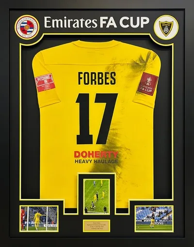 Framed Forbes Harborough Town football shirt with match images and engraved plaque